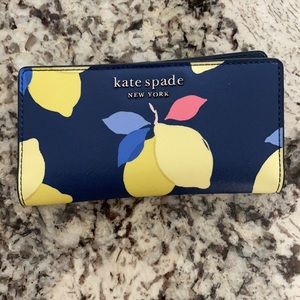 Kate Spade Saffiano Large Slim Bifold Wallets